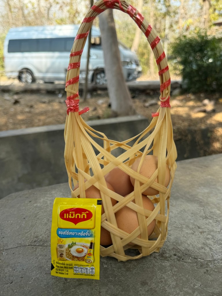 Basket of eggs for cooking in geothermal hot springs at San Kamphaeng near Chiang Mai