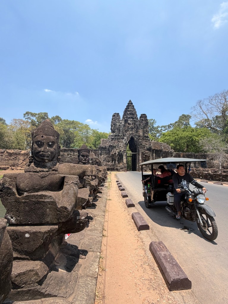 Remorque sitting on bridge near Angkor temple gate in Siem Reap Cambodia
